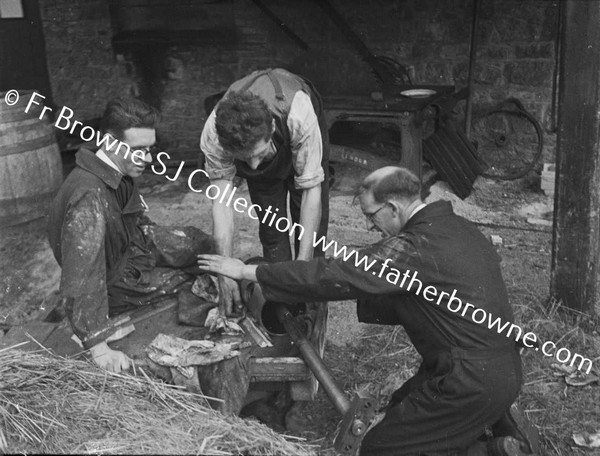 BROTHER JOE KEARNEY S.J. WITH ENGINEERS SETTING UP NEW ENGINE AT ST MARY'S EMO